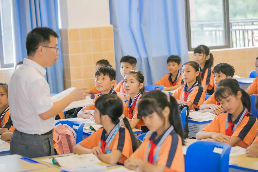 Teacher and students in a bright classroom